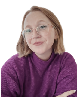 Kelly, smiling, in a purple sweater